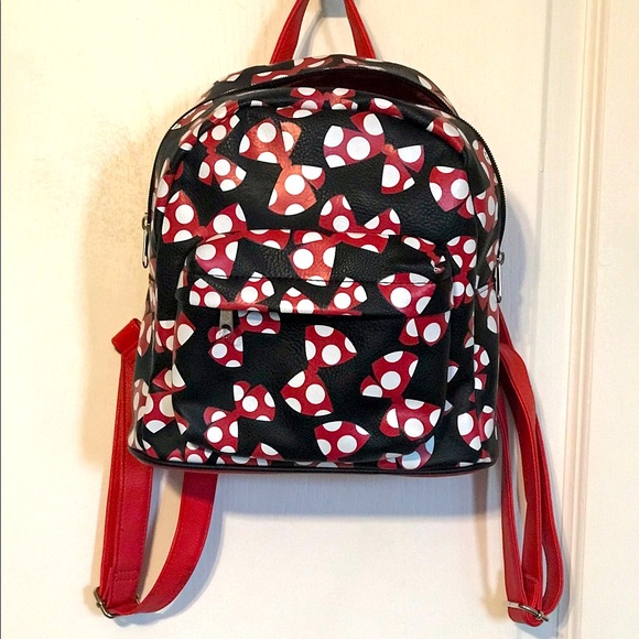 A beautiful Mini Disney Backpack with one packet outside. - Picture 1 of 9